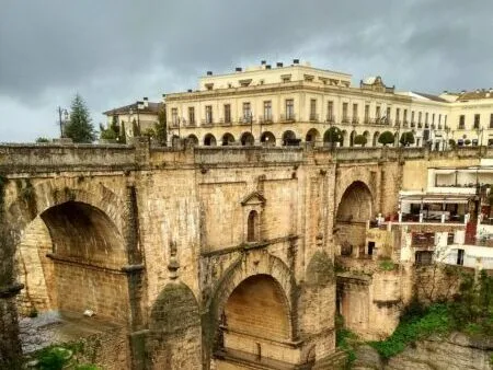 The Roman Bridge in Ronda, Spain, spanning the Tajo Gorge with dramatic views of the surrounding landscape