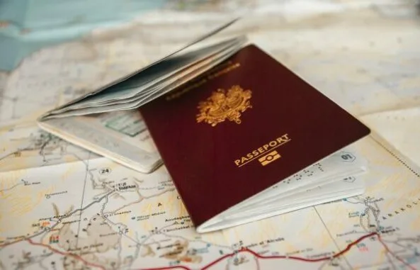 Close-up of a passport with stamps, ready for international travel, symbolizing trip planning